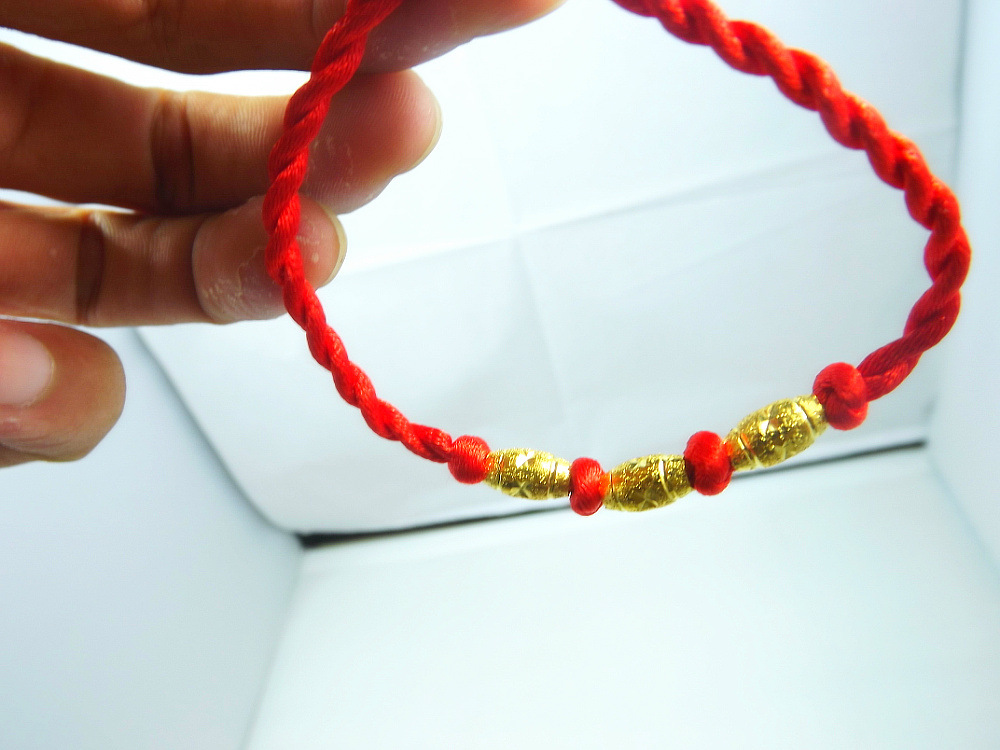 批发采购手饰-本命年红绳带仿金手链批发,渡2