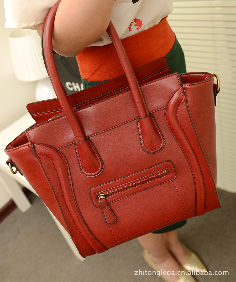 【L-207高端大牌工艺古典复古笑脸牌杀手包定