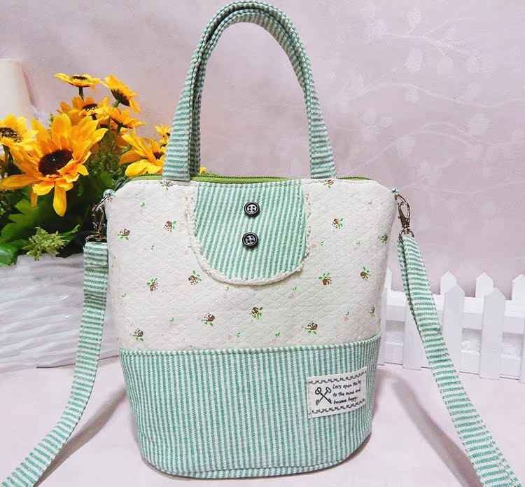 豎條紋花朵雙扣單拉手提斜挎包2