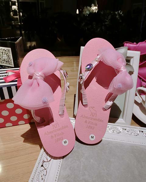 雏菊花朵粉色蝴蝶结度假沙滩拖鞋厚软底夏天人字拖女平跟防滑凉鞋