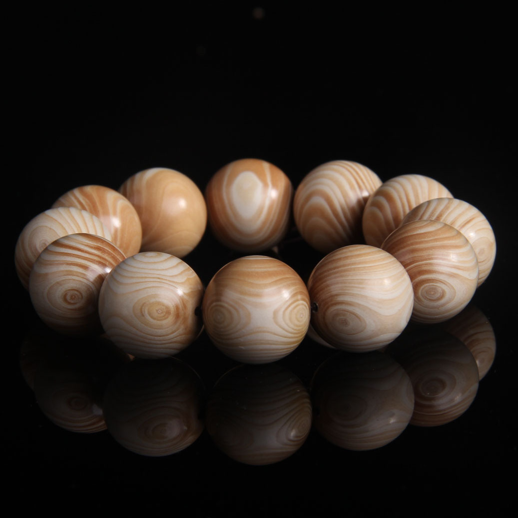 直销 象牙木白花梨木手串手链佛珠对眼鬼脸纹理清晰鬼眼批发